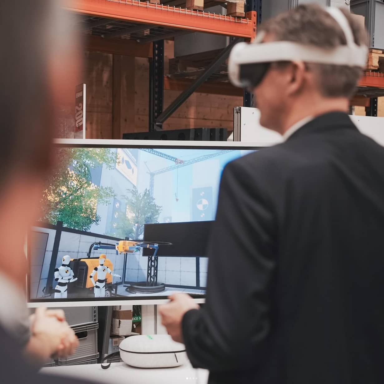 audience experiencing a live Drone Simulator VR demonstration with real-time visual output on an external screen